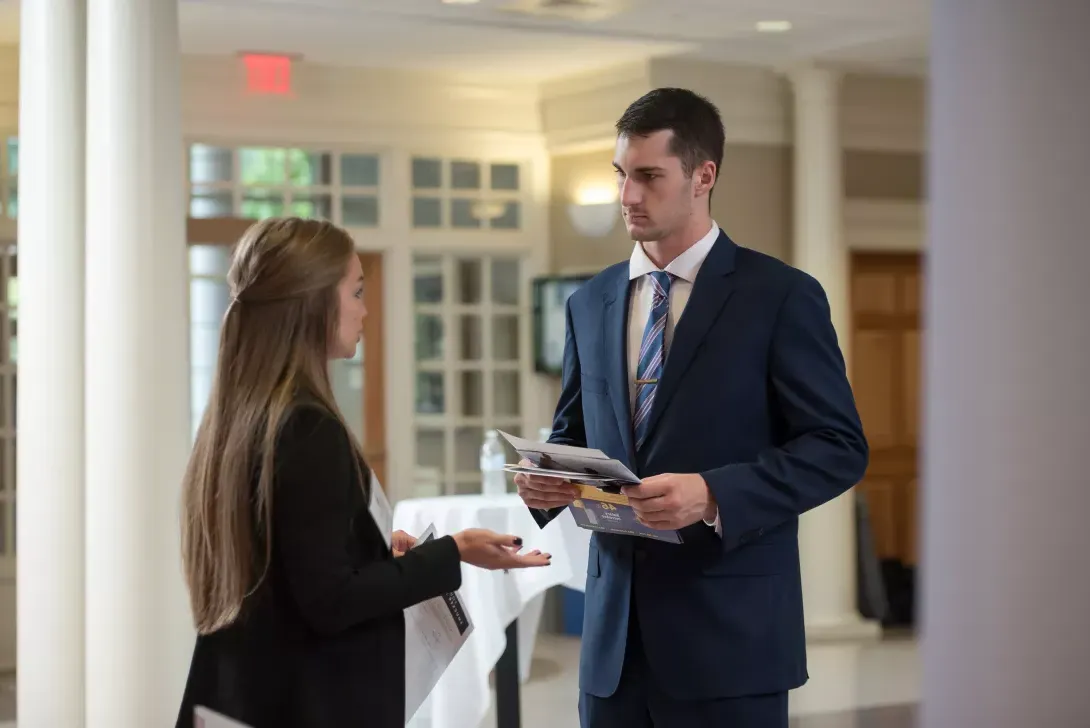 Student talking with a representative at Career Day